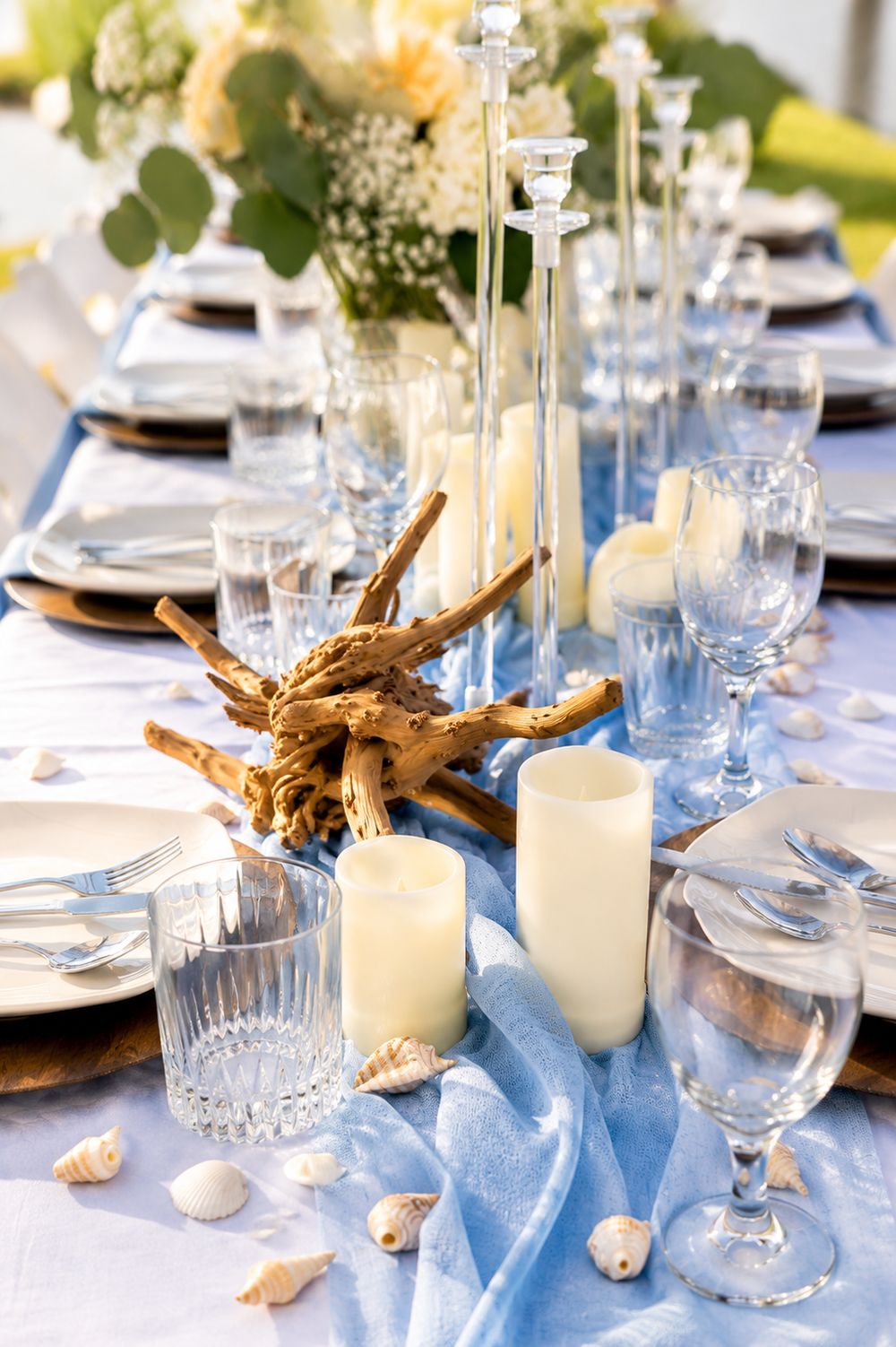 Coastal tablescape with seashells and driftwood