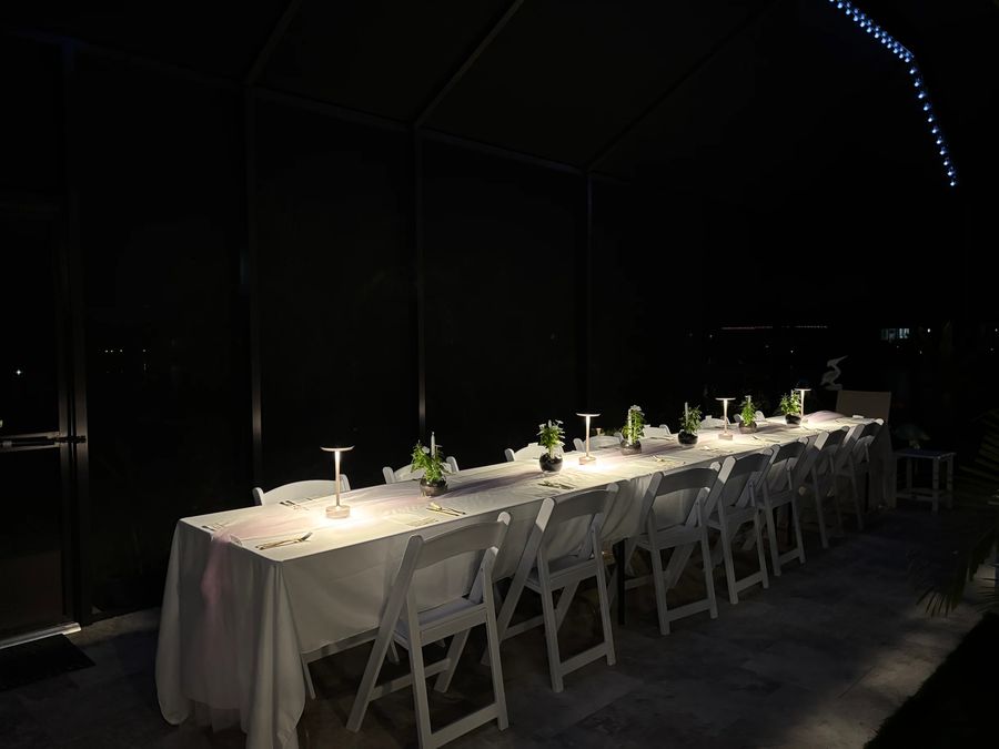 A resin folding chair setup at an outdoor event.